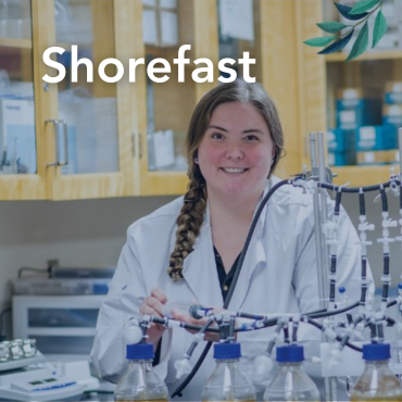 A picture of Dr. Christina Smeaton in her laboratory, with the word "Shorefast" written on top